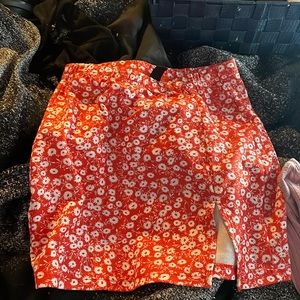 x’s skirt cut at the leg